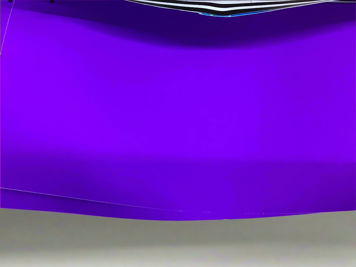 This image features a vibrant poster displayed on a wall. The poster is predominantly purple, presenting a bold and eye-catching aesthetic.