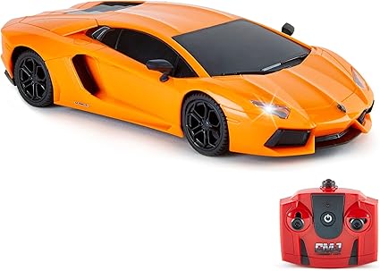 Orange toy car and remote control on a white background