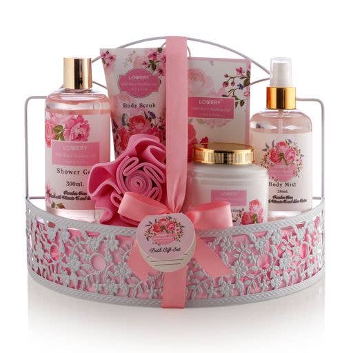 Bath gift set with pink and floral-themed products in a decorative basket.