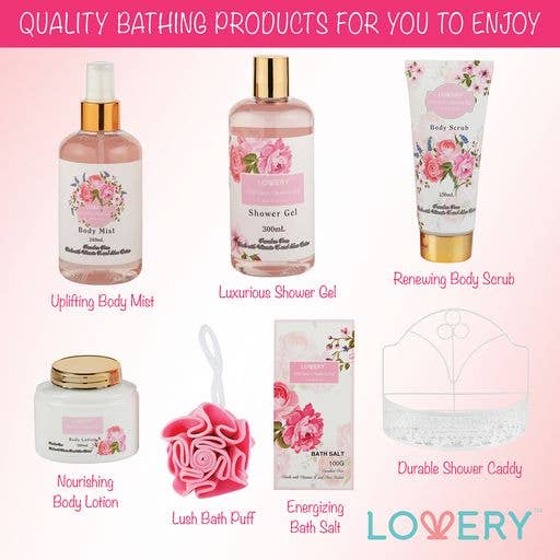 Collection of LOVERY bath and body products including body mist, shower gel, scrub, lotion, bath salt, and bath puff on a pink background.
